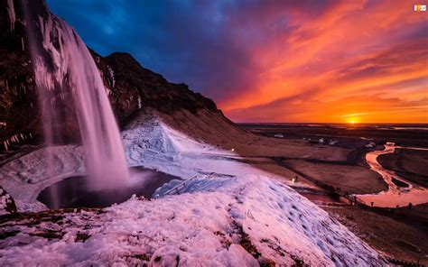 Zachód słońca Zima Wodospad Islandia Skały Se