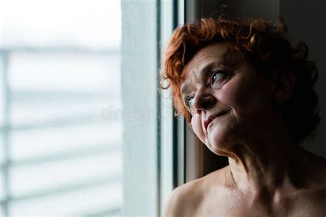 Mature Woman By The Window Thinking About Life Stock Photo Image Of