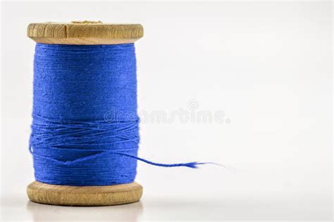 Reel Or Spool Of Blue Sewing Thread Isolated On White Shallow D Stock