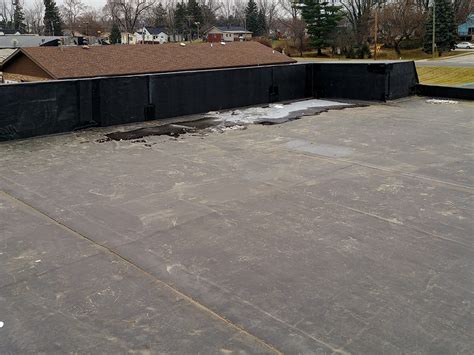 Professional Flat Roof Repair & Water Management | Battle Creek