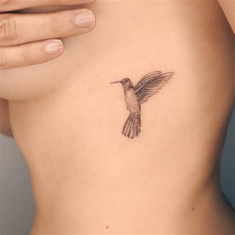 Micro Realistic Style Hummingbird Tattoo Done On The