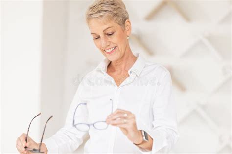 Glasses Options And Woman Shopping In An Optometry Store While Shopping For Prescription Lenses