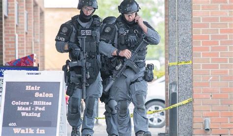 Police Tactical Officers Patrol A Business Complex In Southeast Calgary