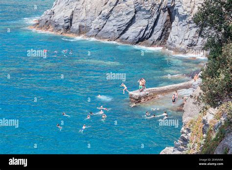 Holiday Makers Swimming Manarola Cinque Terre Liguria Italy Stock