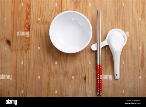 Empty Chinese Rice Bowl With Spoon And Chopsticks Stock Photo Alamy