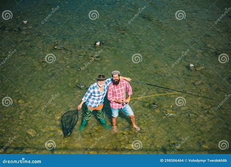 Two Men Friends Fisherman Fishing On River Old Father And Son With Rod