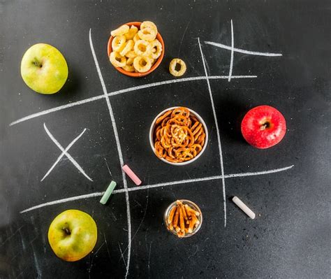 Premium Photo Tic Tac Toe Healthy And Unhealthy Snack Concept With