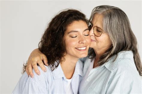 Premium Photo Happy European Elderly Woman Hugging Kissing Millennial