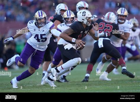 Stanford Quarterback Ashton Daniels Foreground Scrambles From