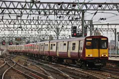 Two ScotRail Class 314 'PEP' EMUs in the obsolete SPT 'Carmine & Cream ...