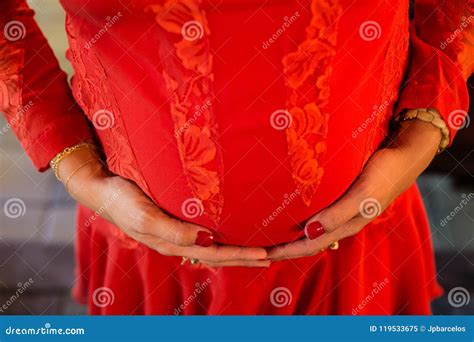 Detail Of Pregnant Woman With Red Dress With Hands On Belly Stock Image Image Of Birth Belly