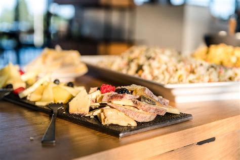 Premium Photo Close Up Of Food In Trays On Table