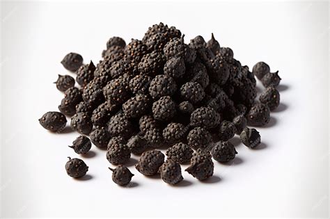 Premium AI Image | Black pepper seeds in a pile isolated on a white backdrop