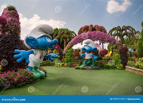 Huge Smurf Figures And Colorful Flower Arrangements In Dubai Miracle