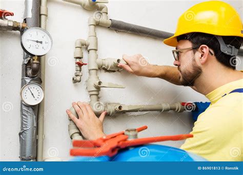 Plumber Doing Maintenance Jobs For Water And Heating Systems Stock