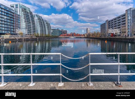 View Of Modern Apartments Reflection In Water In Salford Quays