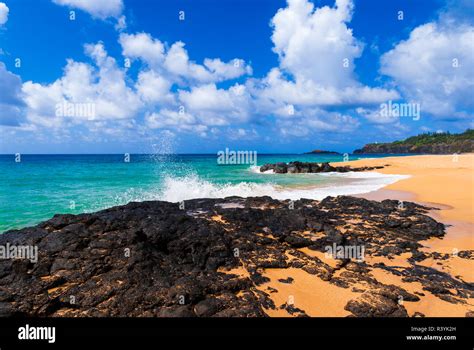 Surf And Lava Rock At Secret Beach North Shore Island Of Kauai