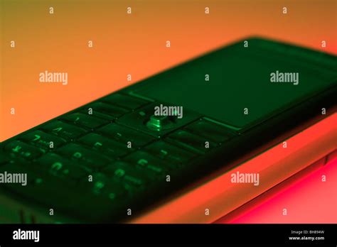 Mobile Phone Lit With Orange Light Stock Photo Alamy