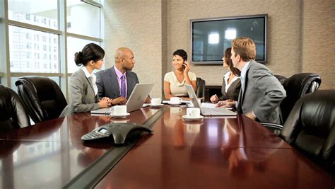 Female African American Executive In A Boardroom Meeting With Her Multi