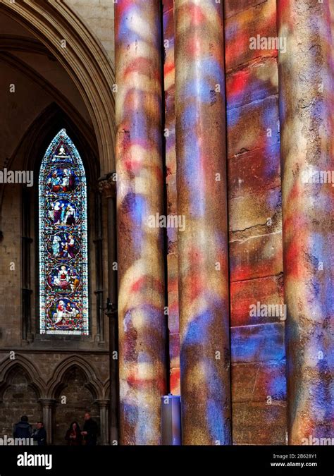 The Stained Glass Windows In Lincoln Cathedral Cast Mottled Colours