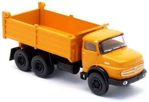 A Yellow Toy Truck On A White Background