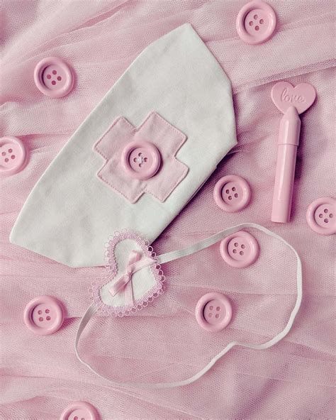 Download Pink Nurse Capand Accessories Aesthetic Wallpaper