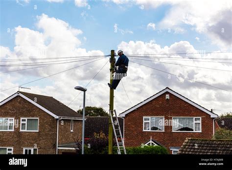 Bt Engineer Repairing Telephone Line Up Telegraph Pole Working On Line