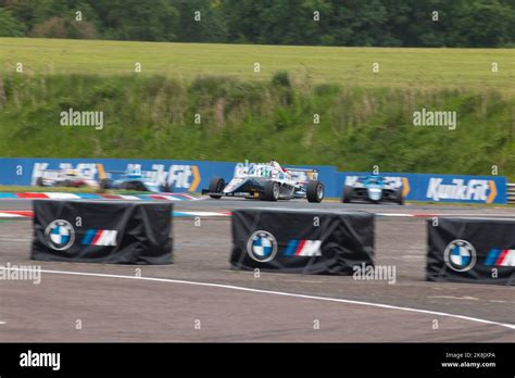 A Rokit F4 Championship Car Cornering On The Track At Thruxton Stock