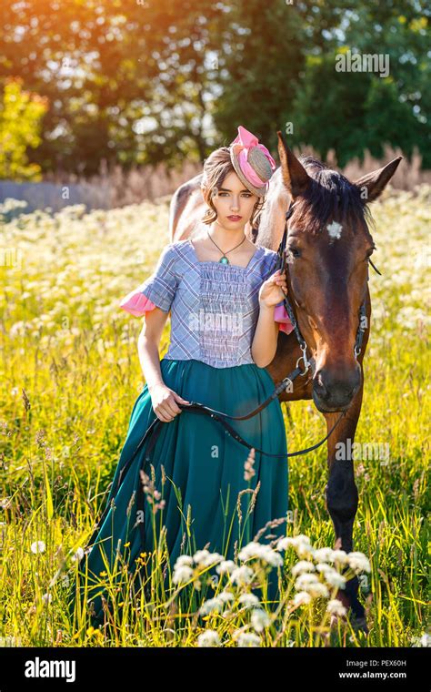 Sunny Day Beautiful Woman Standing Next To The Horse Stock Photo Alamy