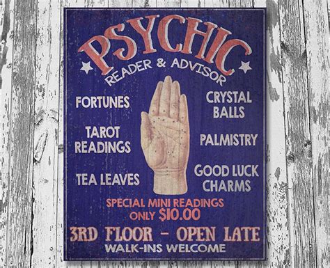 A Sign On The Side Of A Wooden Fence Advertising Psychic Reading