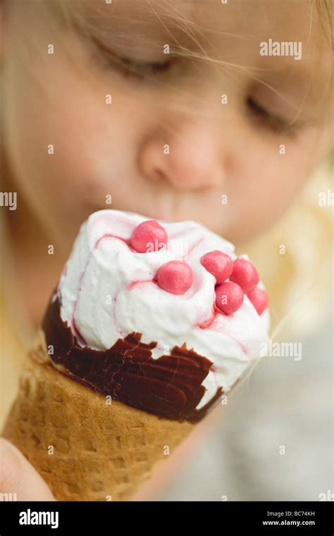 Child eating ice cream cone Stock Photo - Alamy