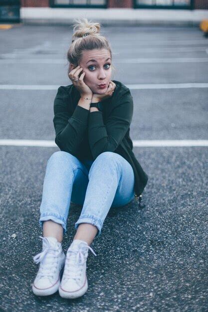 Premium Photo Young Woman Sitting On Floor