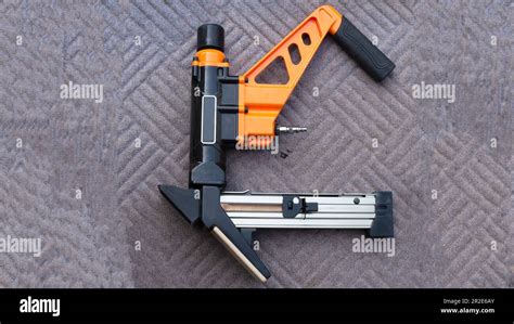 Air Powered Flooring Nail Gun Stock Photo Alamy