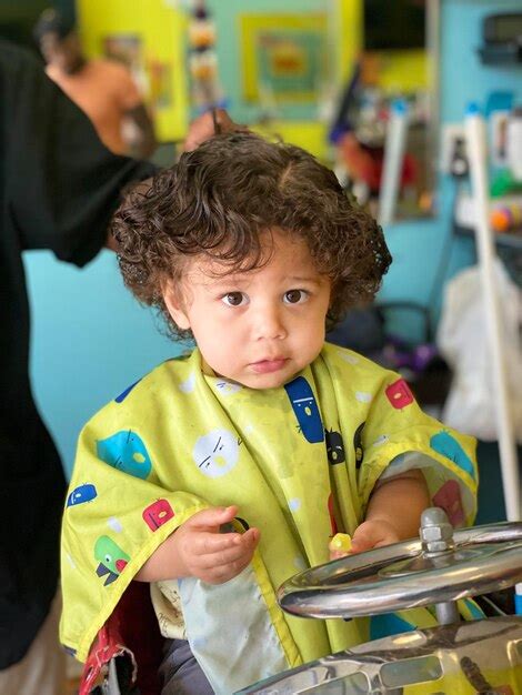 Premium Photo High Angle View Of Cute Baby Boy Haircut