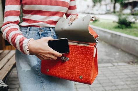 Premium Photo Midsection Of Woman Holding Bag