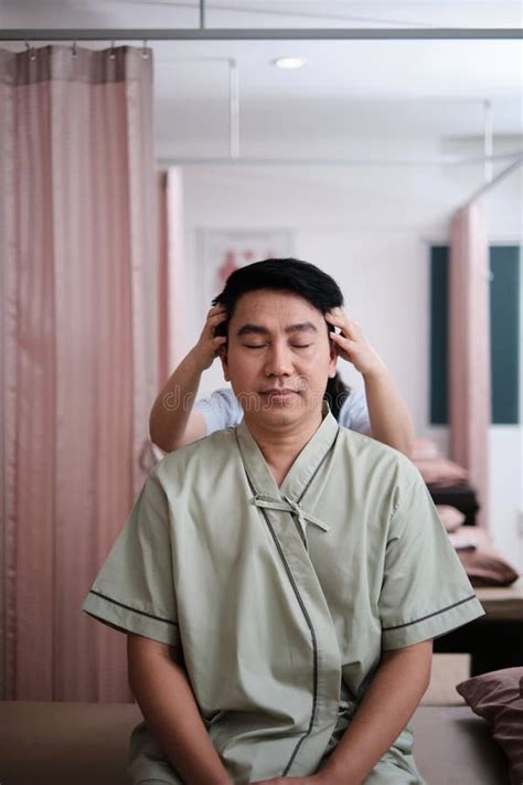 Asian Mature Man Patient Is Being Head Massaged By Physical Therapist Stock Image Image Of