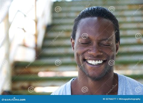 Portrait Of An African American Man Laughing With Eyes Closed Stock