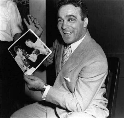 World Middleweight Champion Marcel Cerdan Holding A Photo Of His Title