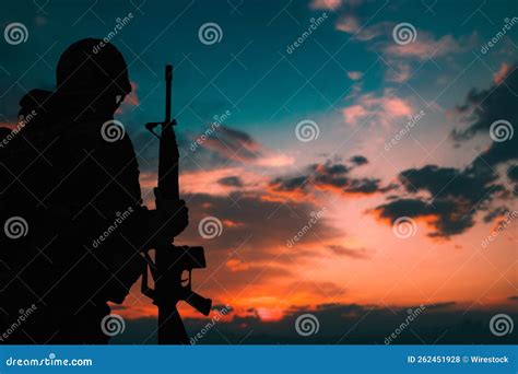 Silhouette of a Military Soldier with Weapons at Sunset Stock Photo ...