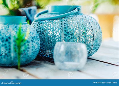 Closeup Decorative Blue Candle Lanterns On Wooden Table With Beautiful