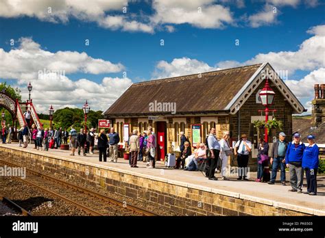 UK, Yorkshire, Settle,passengers on Railway Station platform waiting ...