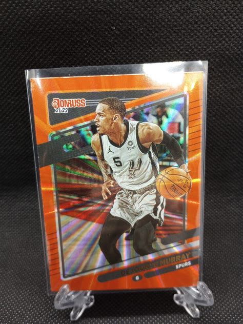 Panini 2021 22 Donruss Dejounte Murray Orange Laser Insert Spurs 157