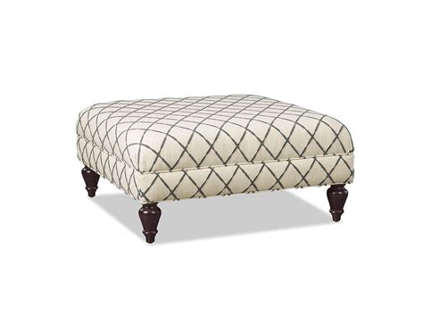 A Lovely Cocktail Ottoman Perfectly Square And Featuring Tapered