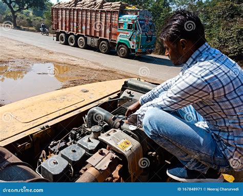 Automobile Workers Repairing Hydraulic Engine At Workshop In India Dec