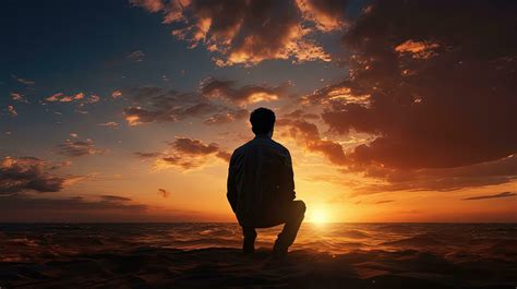 Man Waiting At Sunset Golden Sky Silhouette Stock Photo At