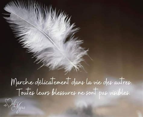 A White Feather Sitting On Top Of A Table