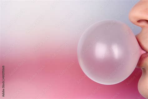 Person doing bubble with chewing gum on bright background Stock Photo ...