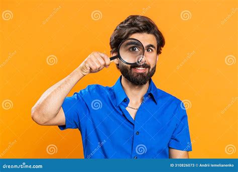 Investigator Researcher Man With Magnifying Glass Near Face Looking