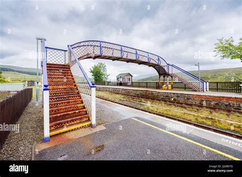 The Rusty Pedestrian Footbridge Over The Tracks At The Railway Station