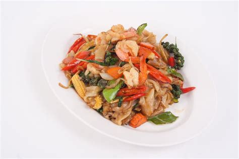 Spicy Stir Fried Flat Noodle With Prawn And Holy Basil Leaves Stock